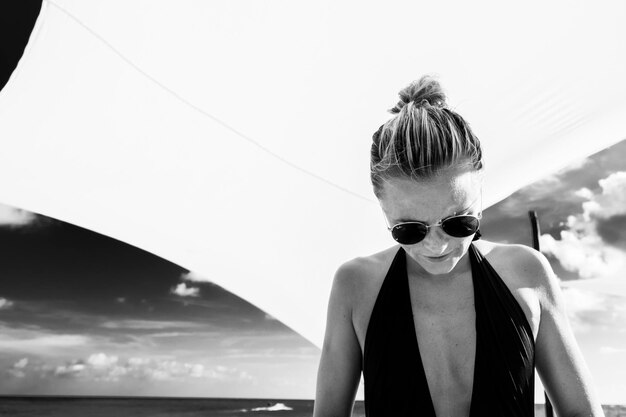 Young woman against clear sky