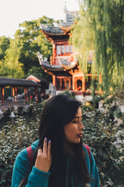 Young woman against shrine