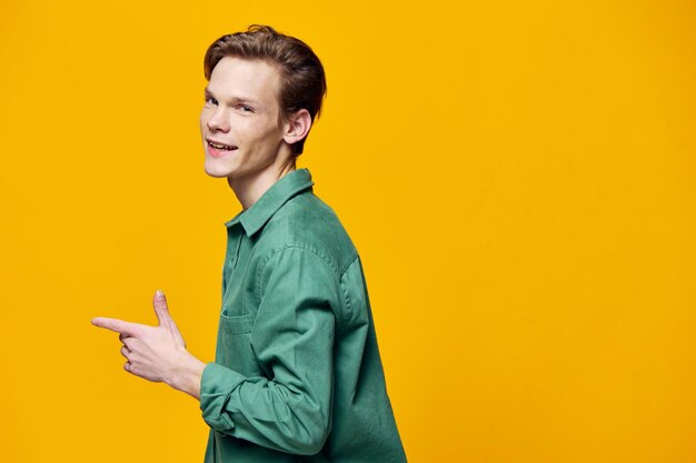 Young woman against yellow background