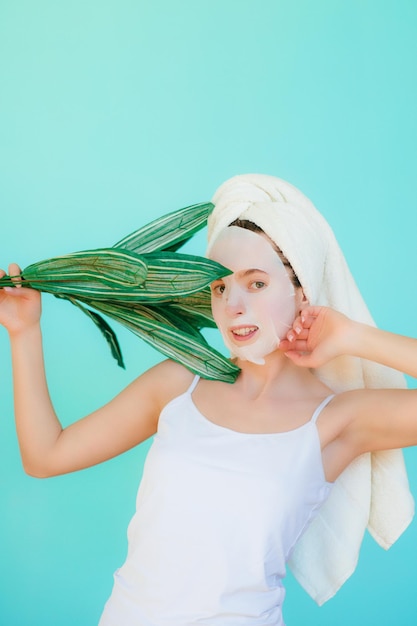 Young woman applying face mask at home. natural skin care routine. cleaning face with natural cosmet