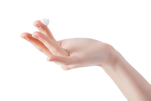 Young woman applying hand cream. Hands with moisturizing cream.