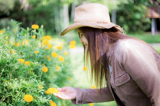 Young woman of asian in garden with the sunlight.