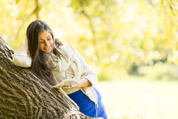 Young woman in autumn forest