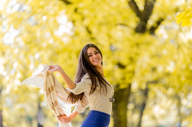 Young woman in the autumn forest