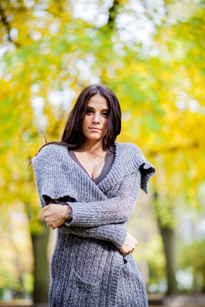 Young woman in the autumn forest