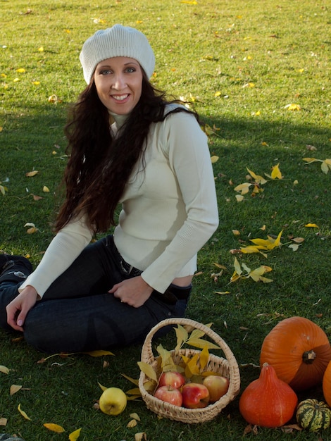 Young woman in autumn park.