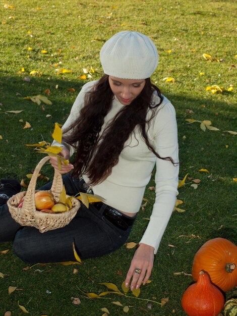 Young woman in autumn park.