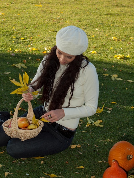 Young woman in autumn park.