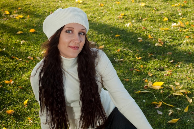 Young woman in autumn park.