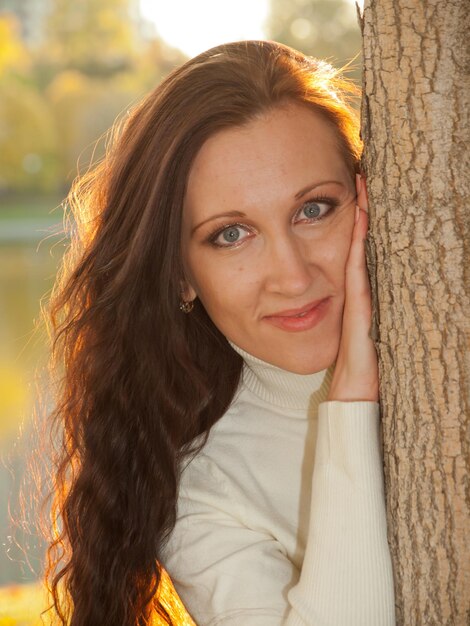 Young woman in autumn park.