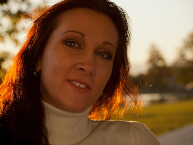 Young woman in autumn park.