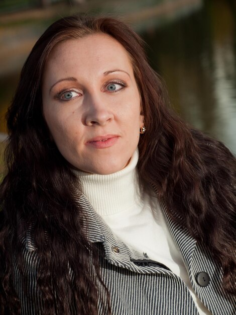 Young woman in autumn park.