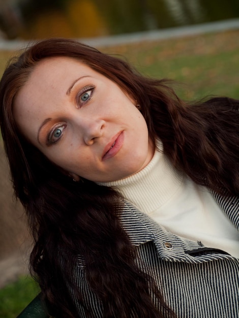 Young woman in autumn park.