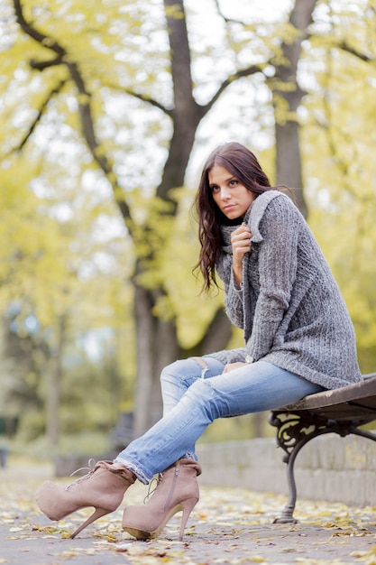 young woman at autumn park