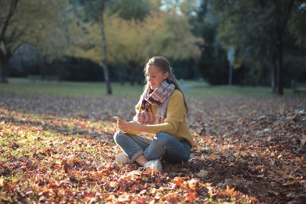 young woman in autumnal park