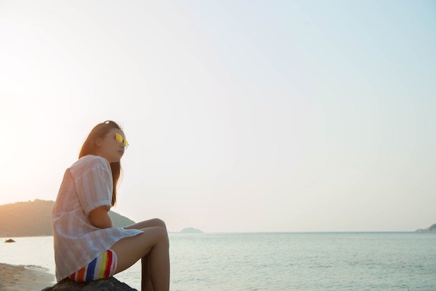 Young woman on the beach and be sad concept