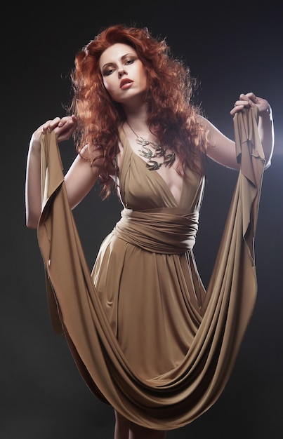 young woman in beige long dress