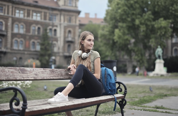 Young woman on a bench in the city