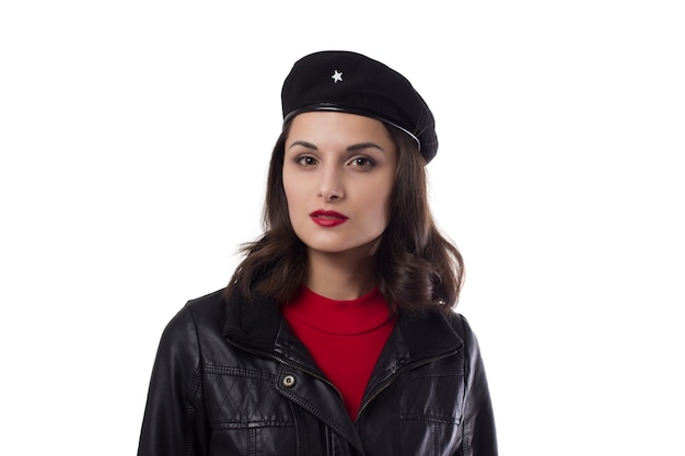 Young woman black jacket and hat with a reference to Ernesto Che Guevara looking in camera