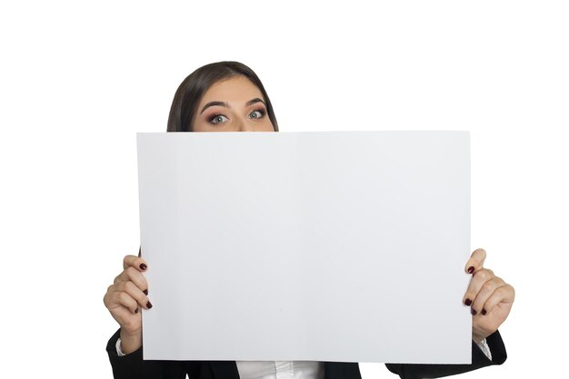 Young woman in black suit standing with white sheet of paper