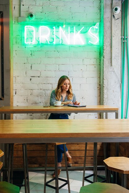 Young woman blogger working with new technology devices