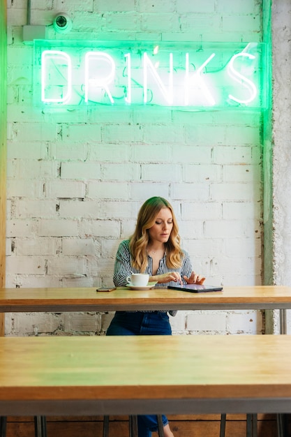 Young woman blogger working with technology