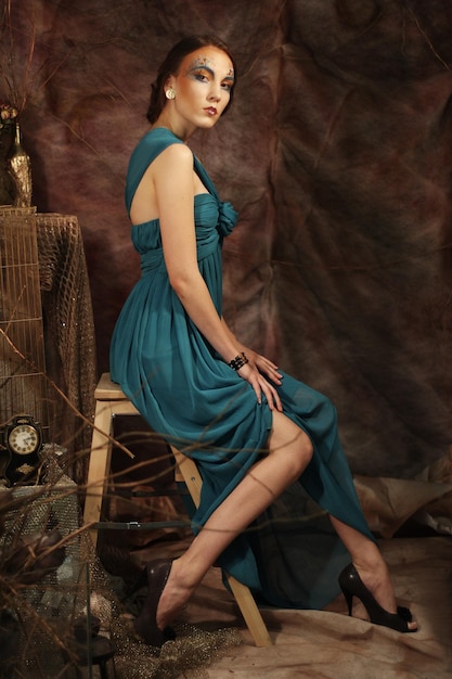 Young woman in blue dress