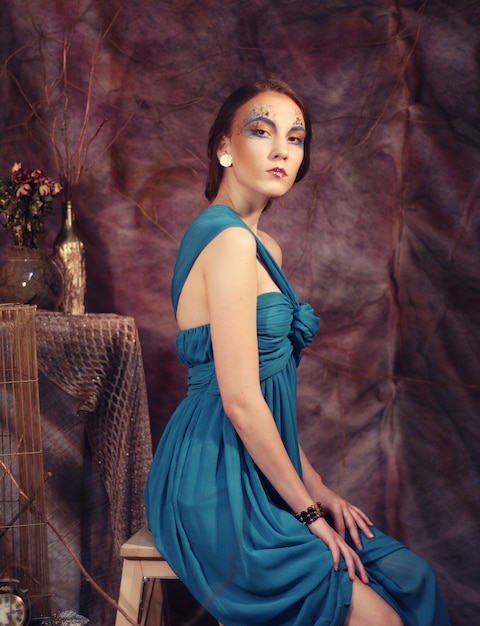 Young woman in blue dress