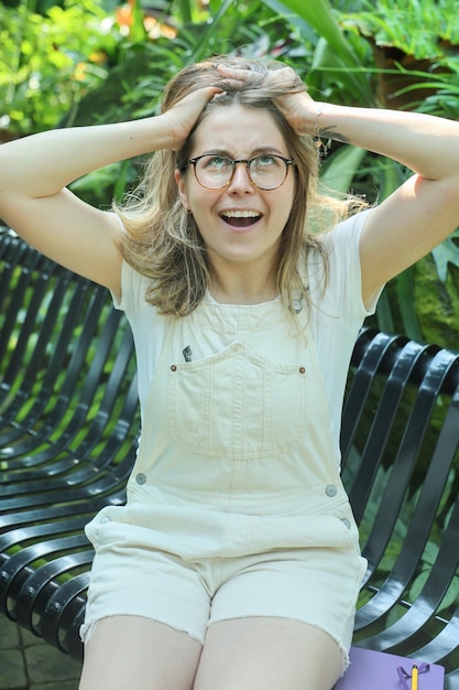 Young woman botanist at work in a botanical garden