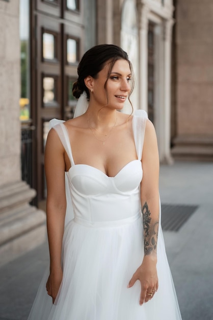 Young woman bride in white dress