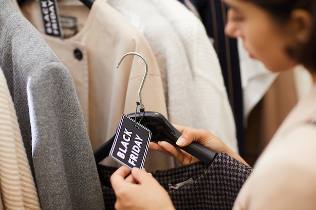 Young Woman Buying Clothes on Sale