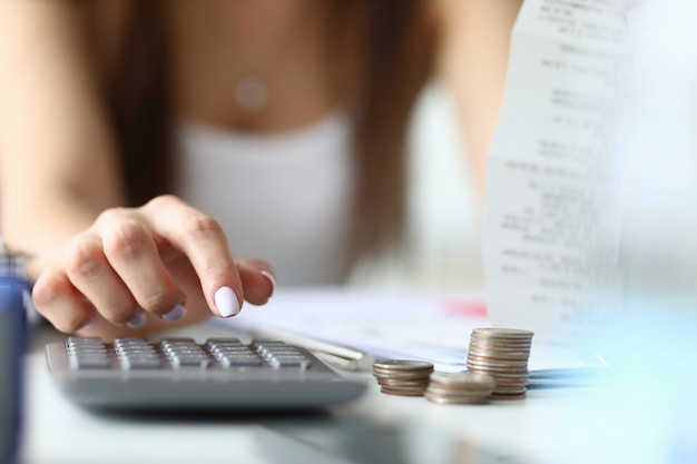 Young woman calculating expenses