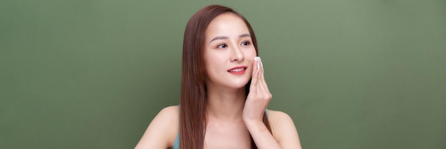 young woman cares for face skin on banner backround