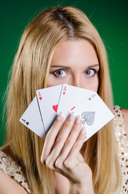 Young woman in casino gambling concept