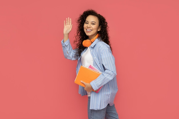 Young woman in casual wearing on pink background