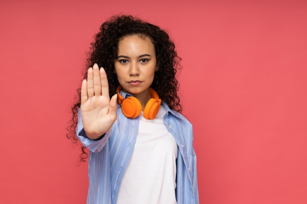 Young woman in casual wearing on pink background