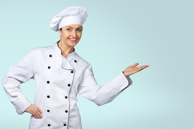 Young woman chef in white uniform