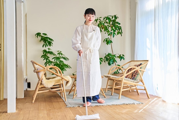 Young woman cleaning the flooring