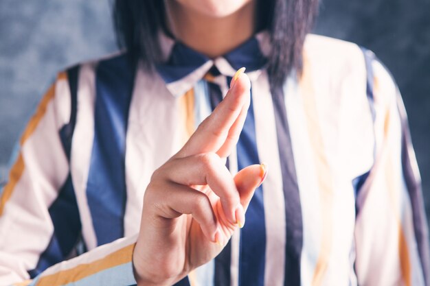 Young woman clicks on virtual screen