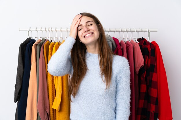 Young woman in a clothing store laughing