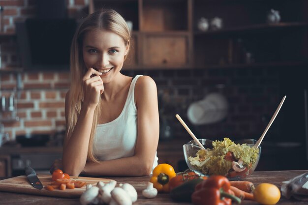 Young Woman Cooking. Healthy Food - Vegetable Salad. Diet. Dieting Concept. Healthy Lifestyle. Cooking At Home. Prepare Food.