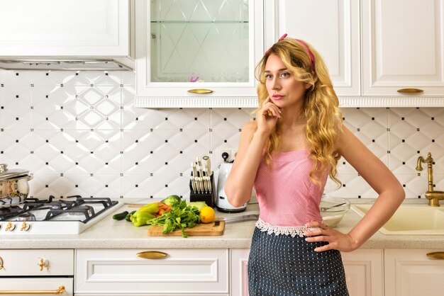 Young woman cooking in the kitchen at home