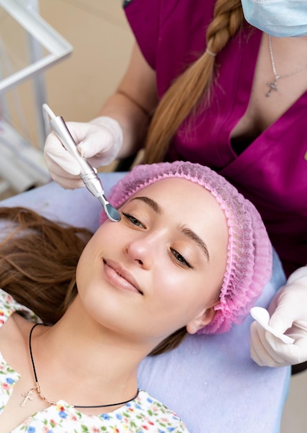 Young woman at cosmetologist Cosmetology procedure Skin and health care