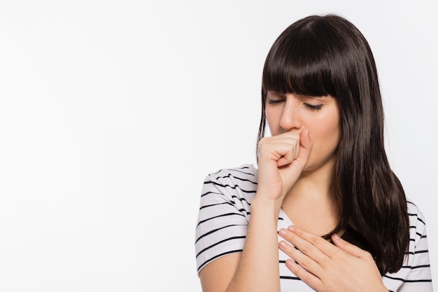 Young woman coughing