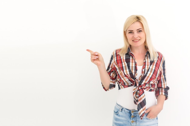 Young woman in coverall on a white background. Female construction worker.