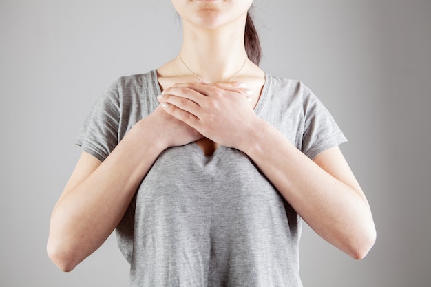 Young woman crossed her arms over her chest