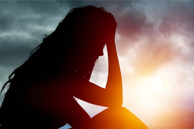 Young woman crying on background