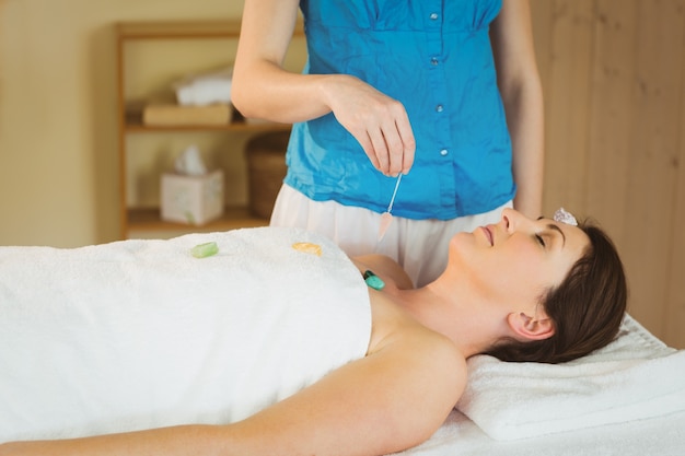Young woman at crystal healing session