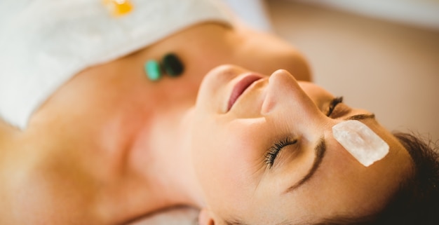 Young woman at crystal healing session