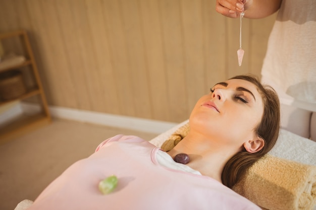 Young woman at crystal healing session